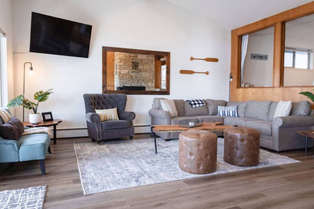 Living room with smart TV and lake views at the Silver Lake House in Everett, WA